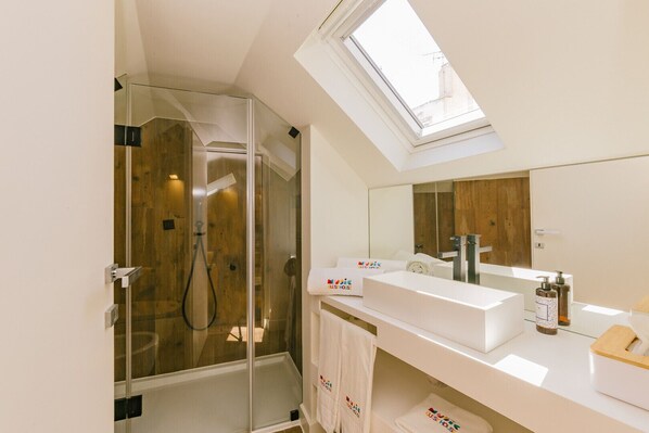 Shower, eco-friendly toiletries, hair dryer, towels