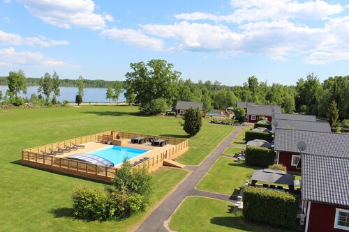 Dream location on the lake with pool, internet, sauna, fire place and boat with electric engine