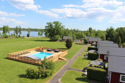 Dream location on the lake with pool, internet, sauna, fire place and boat with electric engine