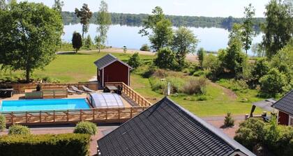 Dream location on the lake with pool, internet, sauna, fire place and boat with electric engine
