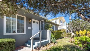 A two-story house with a front porch, a mailbox, and a well-maintained garden. - La Jolla Ocean Dream - Amazing Location, Walk to the Beach, Dog Friendly! (La Jolla)