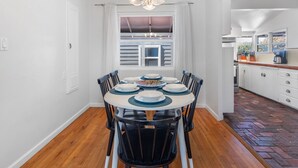 A dining area with a round table, chairs, and a chandelier. - La Jolla Ocean Dream - Amazing Location, Walk to the Beach, Dog Friendly! (La Jolla)