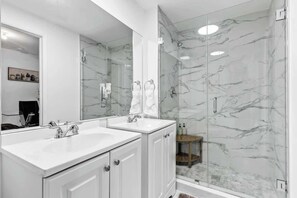 Shower, hair dryer, towels, soap