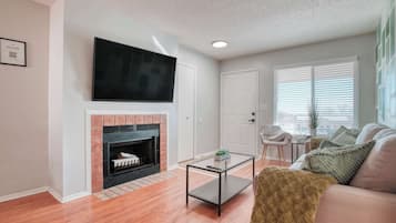 TV, fireplace, books, offices