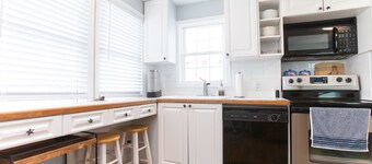 Classic Beach Cottage with front porch view of water