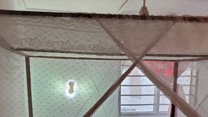 A room with a bed, a window, and a ceiling fan. - Impeccable 2-bed House in Diani Beach Kenya (Diani Beach)