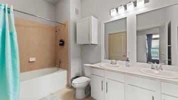 Shower, hair dryer, towels, toilet paper