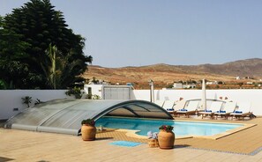 Indoor pool, outdoor pool, pool umbrellas, sun loungers