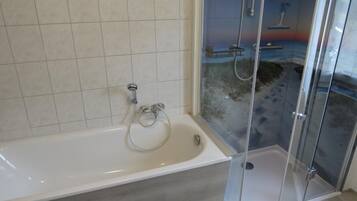 Bathtub, hair dryer, towels