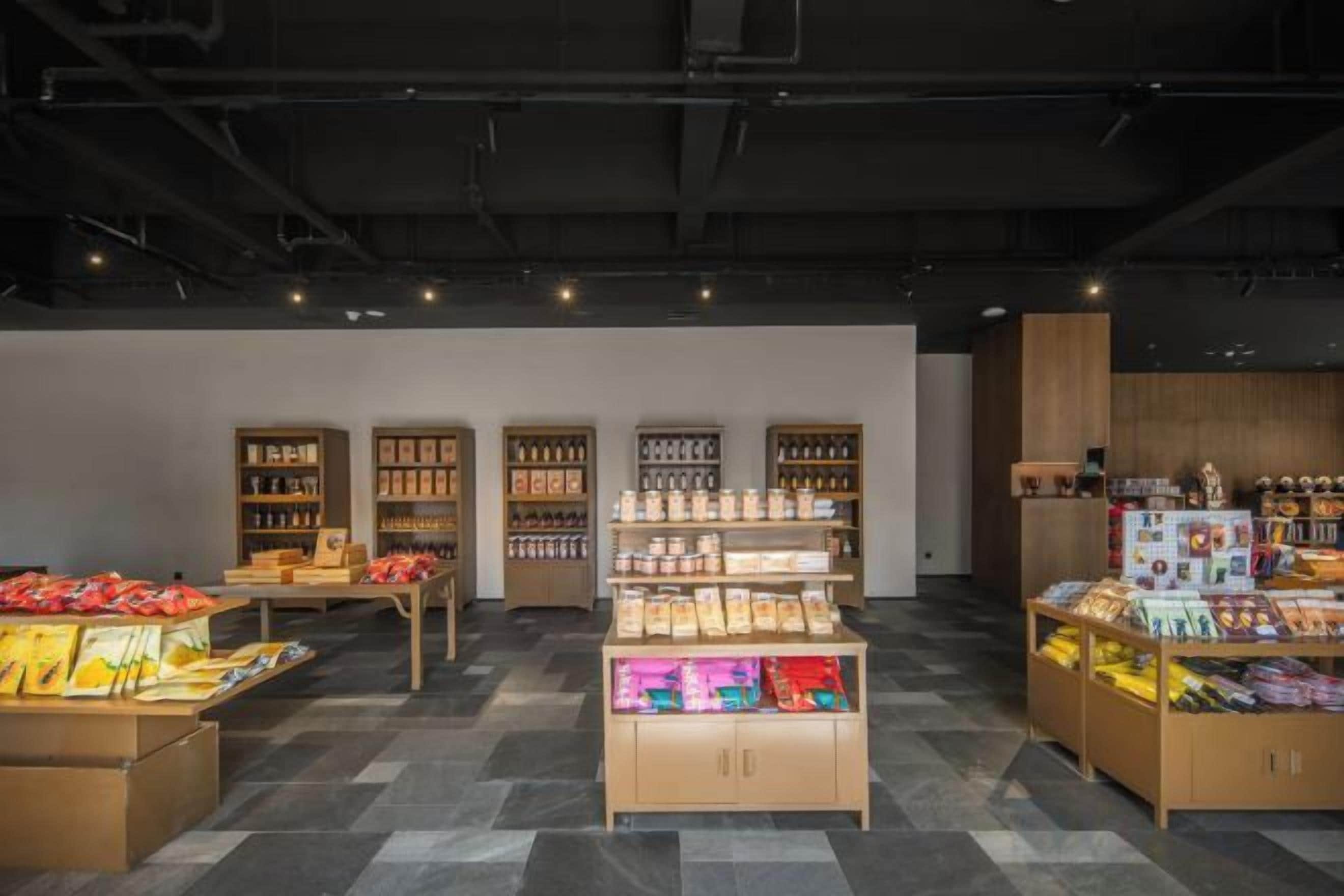 A retail space with display shelves and a central counter.