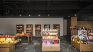 A retail space with display shelves and a central counter.