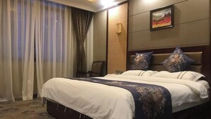 A hotel room with a large bed, a wooden headboard, a wall-mounted TV, and a window with curtains. - Dege Shandi Hotel (Dege)