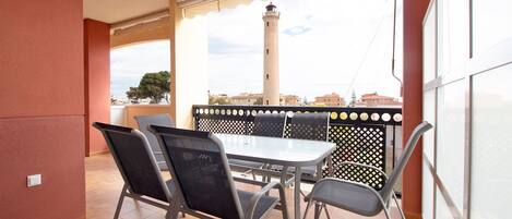 Enjoy meals on the balcony with a view of the lighthouse.