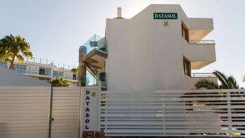 A modern building with a sign reading 'DATASOL' and a logo.