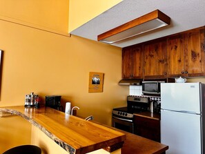 Fridge, microwave, stovetop, coffee/tea maker