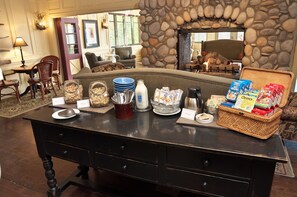 A breakfast buffet with various food items and a stone fireplace in the background. - Hilton Grand Vacations Club Blue Mountain Canada (The Blue Mountains)