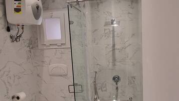 Luxury Apartment, 1 Bedroom, Pool View | Bathroom | Shower, rainfall showerhead, hair dryer, towels