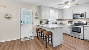 Coffee/tea maker, fridge, microwave, oven