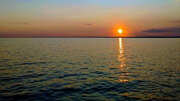 On the beach, sun loungers, beach towels