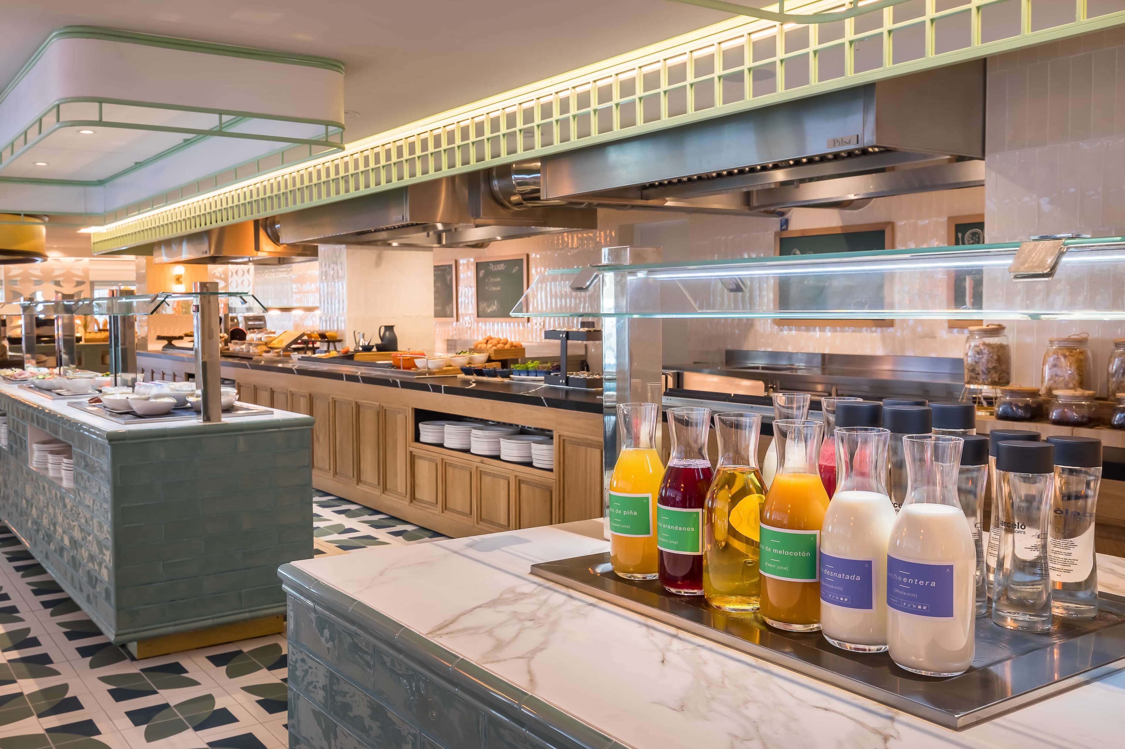 A hotel buffet with a variety of food items and beverages.