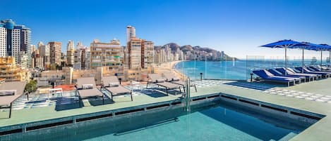 Outdoor pool, pool umbrellas, pool loungers