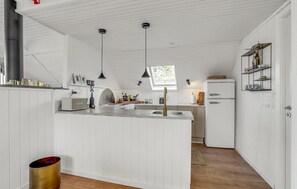 Fridge, stovetop, dishwasher, coffee/tea maker