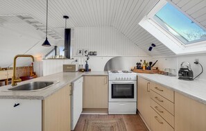 Fridge, stovetop, dishwasher, coffee/tea maker