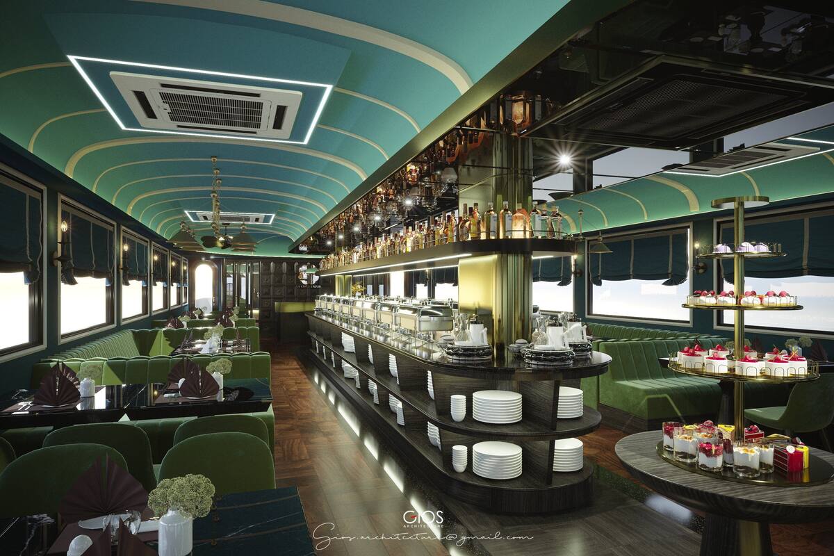 A bar area with a tiered serving counter, green upholstered seating, and a view through the windows.