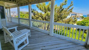 A wooden deck with white railings and two white lounge chairs. - The Salty Lab - Beautiful Ocean & Sound views in this 5 BR "Dog Friendly" home! (Duck)