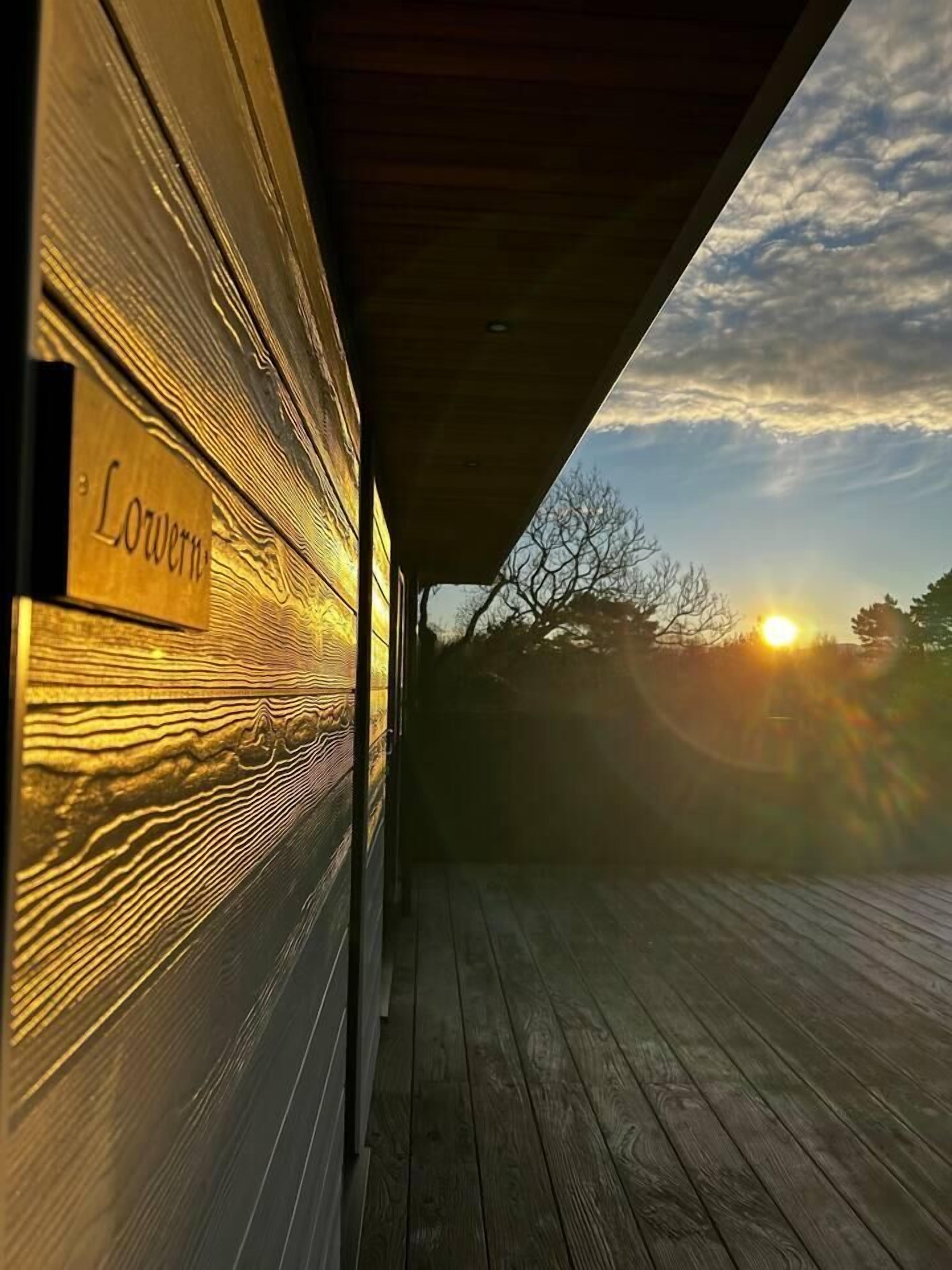 A wooden deck with a nameplate reading "Lower".