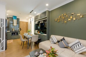 Panoramic Apartment | Living area | 49-inch Smart TV with cable channels, TV - Friendly House QMP - Ecopark (Van Giang)
