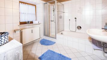 Bathtub, hair dryer, towels