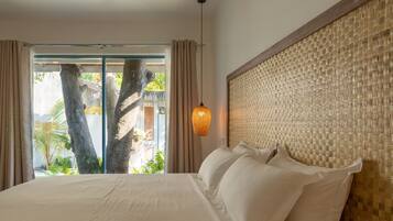 Deluxe Room, Patio, Garden Area | Premium bedding, minibar, in-room safe, individually furnished