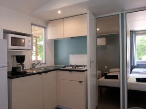 Fridge, microwave, cookware/dishes/utensils