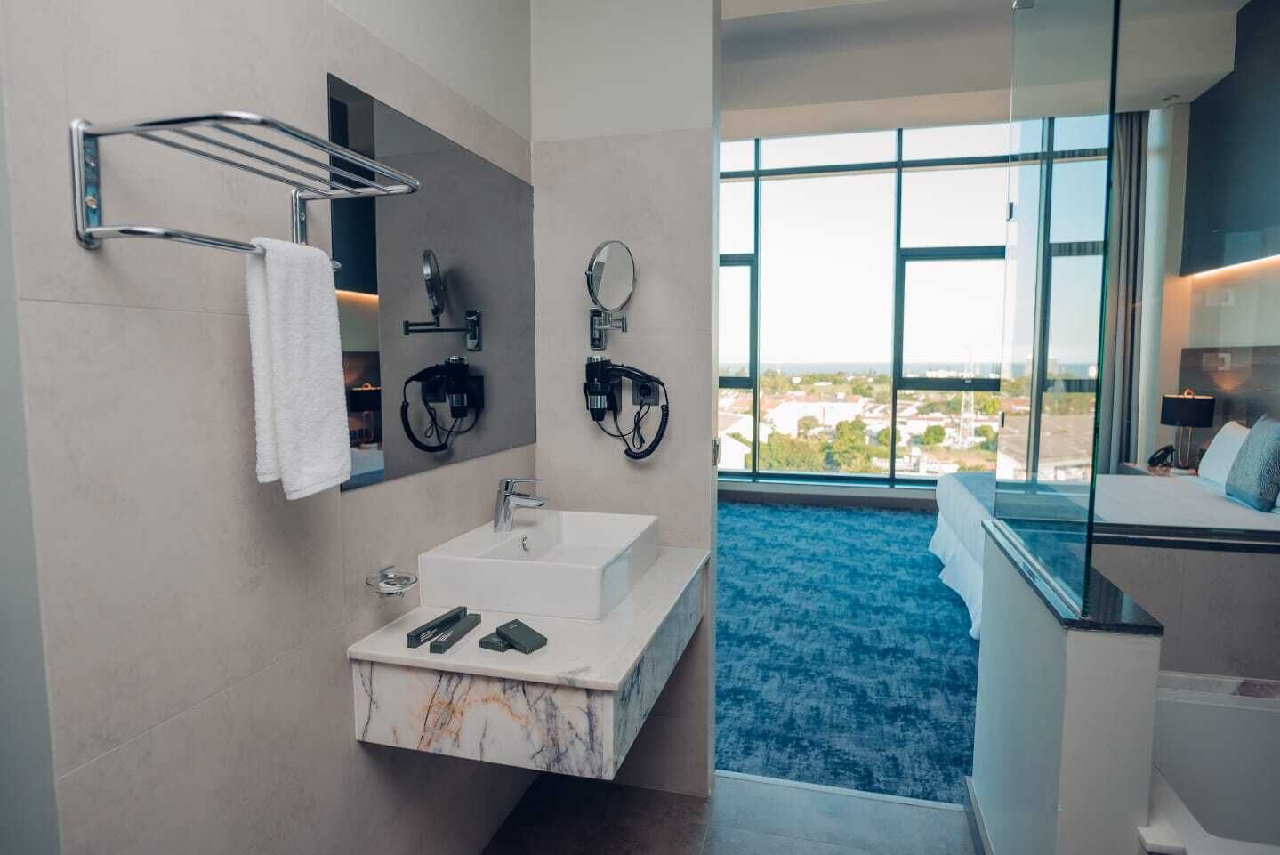 presidential room | bathroom | shower, designer toiletries, hair dryer, slippers