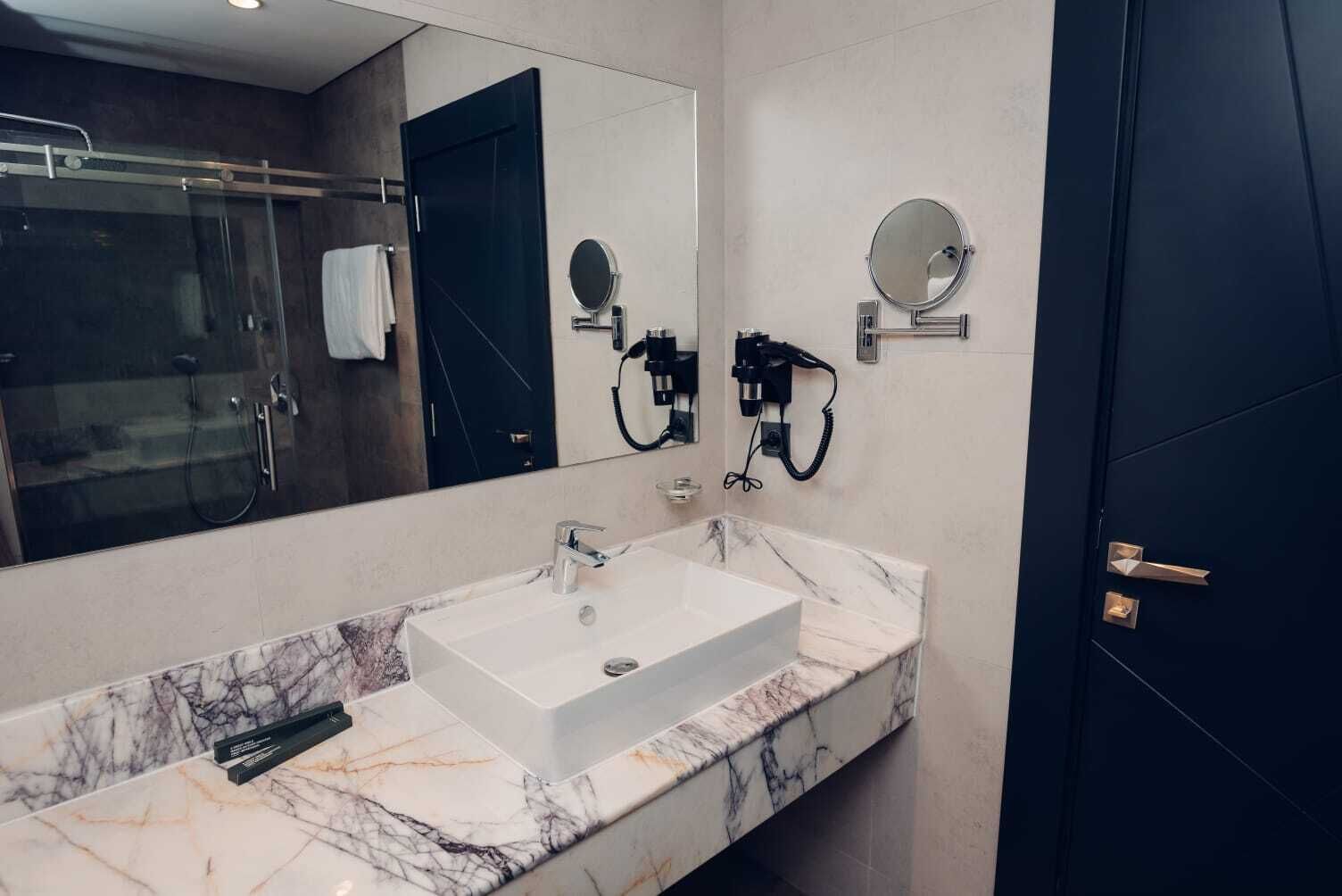 shower, designer toiletries, hair dryer, slippers