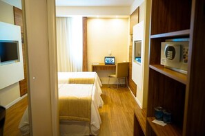 Relax in this stylish room with a comfortable bed, desk, and chair.