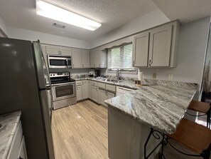 Condo, 2 Bedrooms | Private kitchen | Fridge, oven, coffee/tea maker - Forest view, log-sided two bedroom, two bath condo on Lake Ouachita. by RedAwning (Mount Ida)