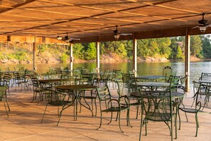 Outdoor dining - Lake view two bedroom, two bath Harbor North luxury cottage with private hot tub overlooking Lake Ouachita. by RedAwning (Mount Ida)