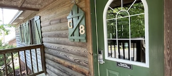 C8, Two bedroom, two bath log-sided, lake view luxury cottage with hot tub by RedAwning