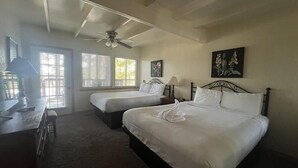 A bedroom with two beds, a ceiling fan, and a desk with a lamp. - Mountain Harbor two bedroom Lodge cottage by RedAwning (Mount Ida)