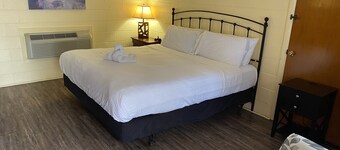 King Guest Room located at the Joplin Inn at the entrance to Mountain Harbor, just 2 1/2 miles from Lake Ouachita. by RedAwning