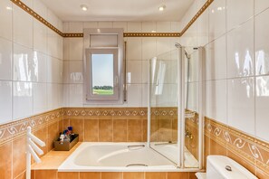 Bathtub, hair dryer, towels