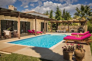 Seasonal outdoor pool, open 9:30 AM to 9:30 PM, pool umbrellas