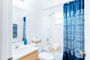 Elite House | Bathroom | Rainfall showerhead, soap, shampoo, toilet paper