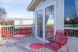 Relax in this serene outdoor space with a seating area and stunning views of the surrounding landscape.