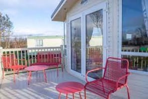Relax in this serene outdoor space with a seating area and stunning views of the surrounding landscape.