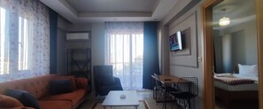 Deluxe Suite | Living area | Smart TV, printers