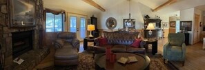 Fireplace, books - Lake view two bedroom, two bath log-sided cottage with private hot tub overlooking Lake Ouachita. by RedAwning (Mount Ida)