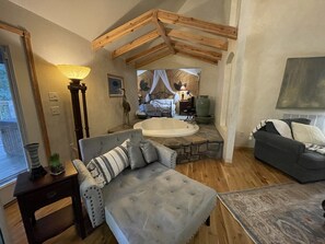 TV, fireplace - One bedroom, one bath log-sided cottage with private hot tub on Lake Ouachita. by RedAwning (Mount Ida)